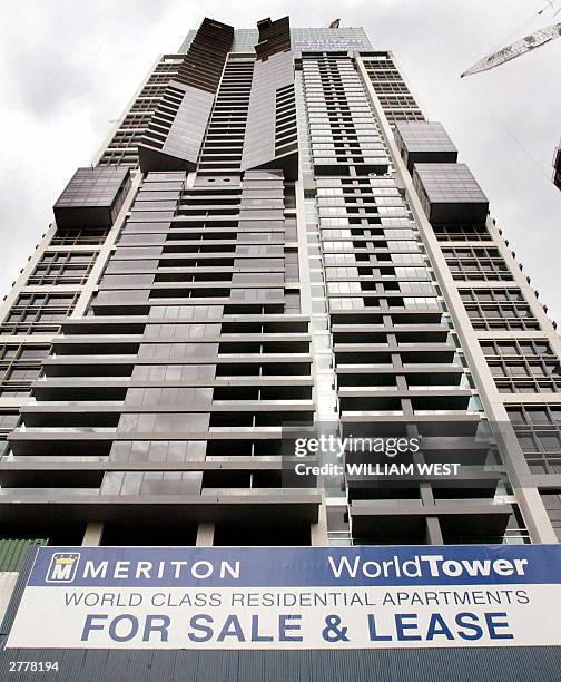 Massive apartment blocks in Sydney's central business district are advertised for sale as the Reserve Bank of Australia raised its interest rates for...