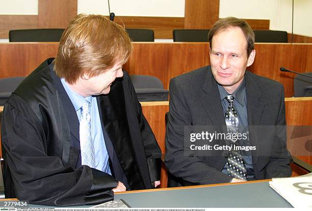 Defense Lawyer Harald Ermel is seen with Computer technician, Armin Meiwes aged, 42 at the prelude to Germany's first cannabalism trial held before...