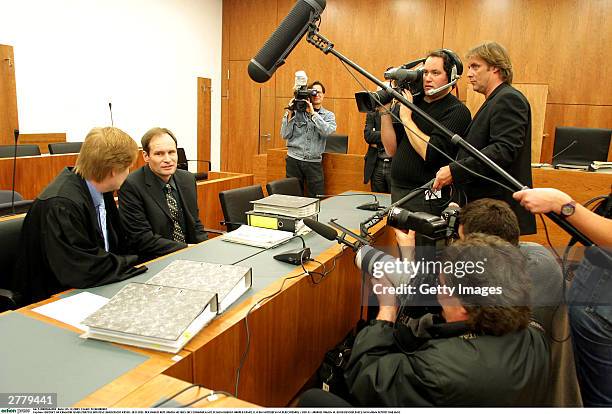 Defense Lawyer Harald Ermel is seen with Computer technician, Armin Meiwes aged, 42 at the prelude to Germany's first cannabalism trial held before...