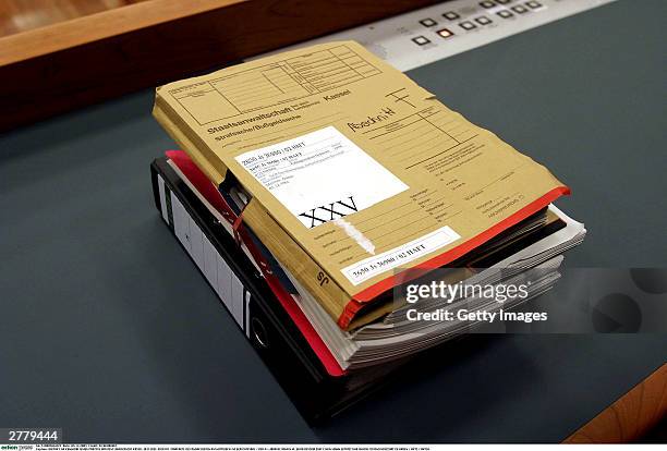 Case Notes are seen on a table at the trial of Computer technician, Armin Meiwes aged, 42 at the prelude to Germany's first cannabalism trial held...