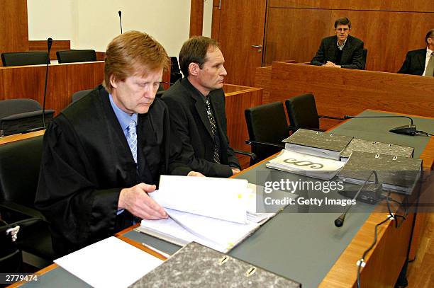 Defense Lawyer Harald Ermel is seen with Computer technician, Armin Meiwes aged, 42 at the prelude to Germany's first cannabalism trial held before...