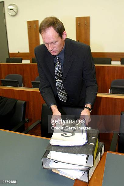 Computer technician, Armin Meiwes aged, 42 is seen attending to case notes at the prelude to Germany's first cannabalism trial held before the...