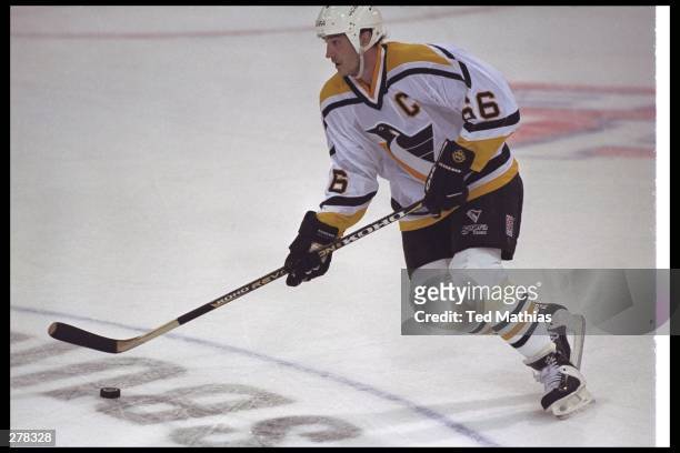 Mario Lemieux of the Pittsburgh Penguins moves with the puck during their 5-3 loss to the Philadelphia Flyers in the Stanley Cup Playoffs at the...