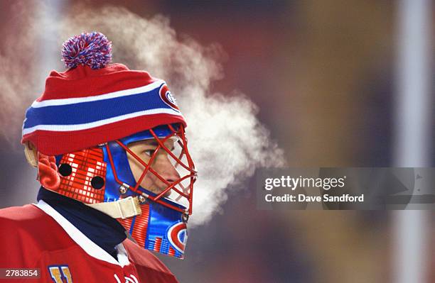 Goalie Jose Theodore of the Montreal Canadiens exhales during the game against the Edmonton Oilers at the Molson Canadien Heritage Classic on...