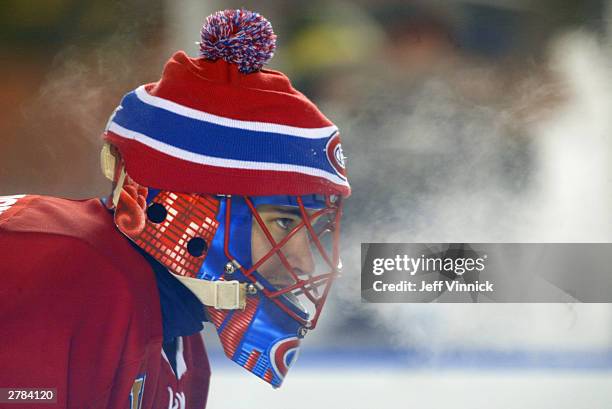 Goalie Jose Theodore of the Montreal Canadiens exhales on the ice during the game against the Edmonton Oilers in the Molson Canadien Heritage Classic...