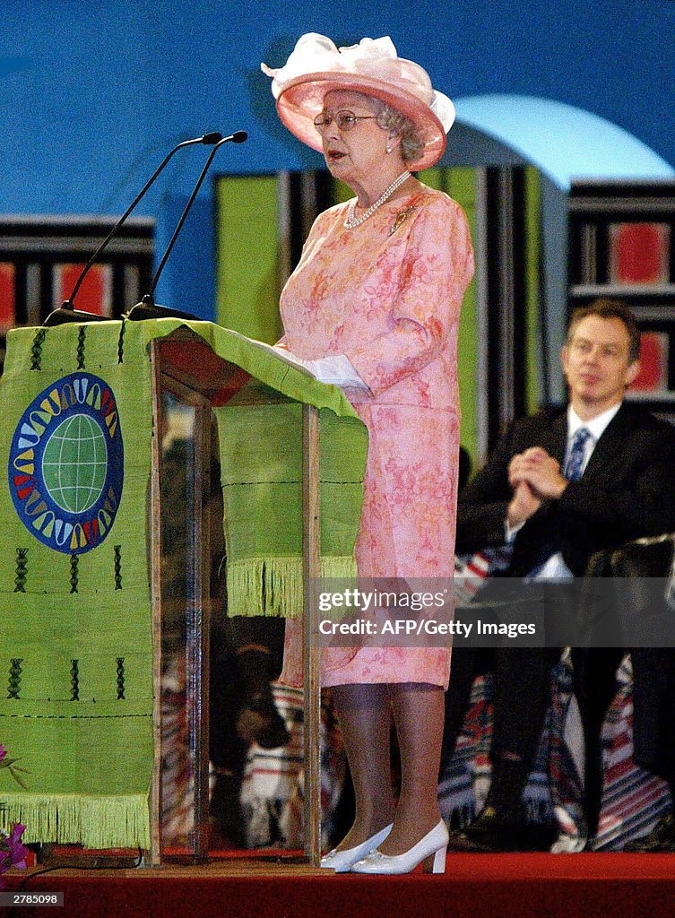 British Prime Minister Tony Blair listens to Britain's Queen... News