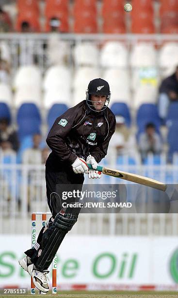 New Zealand batsman Chris Harris plays a ball off Pakistani pace bowler Shoaib Akhtar during the fourth One Day International match between Pakistan...