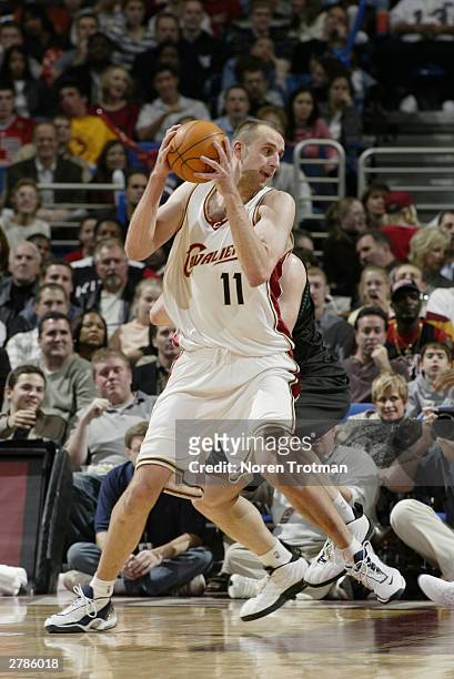 Zydrunas Ilgauskas of the Cleveland Cavaliers holds the ball against the Minnesota Timberwolves during the game at Gund Arena on November 21, 2003 in...