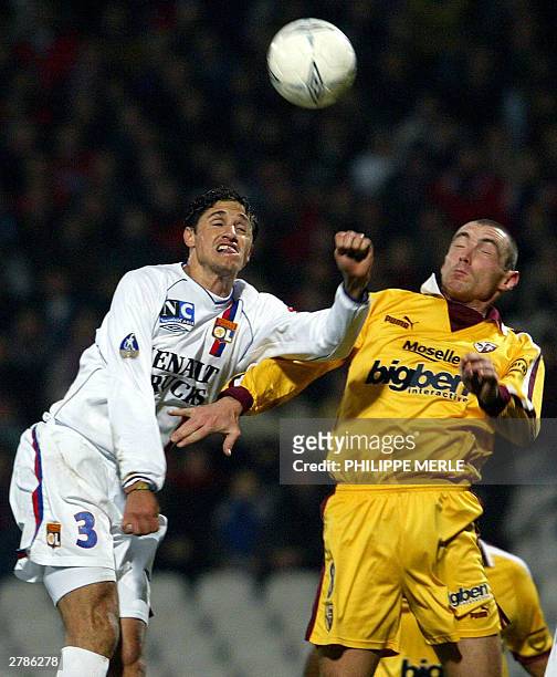 Lyon's midfielder Brazilian Juninho Pernambucano heads off Metz defender Samuel Allegro, during their French L1 soccer match between Lyon and Metz, 5...