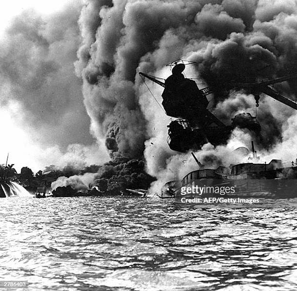 This 07 December 1941 file photo obtained from the US Naval Historical Center shows the USS Arizona, sunk and burning furiously. Her forward...