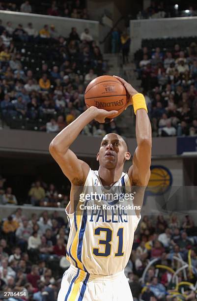 Reggie Miller of the Indiana Pacers shoots a free throw against the New York Knicks during the game at Conseco Fieldhouse on November 27, 2003 in...