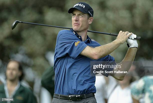 Jim Furyk watches his tee shot on the third tee during the first round of the PGA Grand Slam of Golf on December 5, 2003 at the Poipu Bay Golf Course...