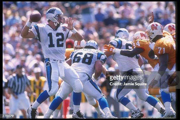 Quarterback Kerry Collins of the Carolina Panthers passes the ball from the pocket during a game against the Tampa Bay Buccaneers at Clemson Memorial...