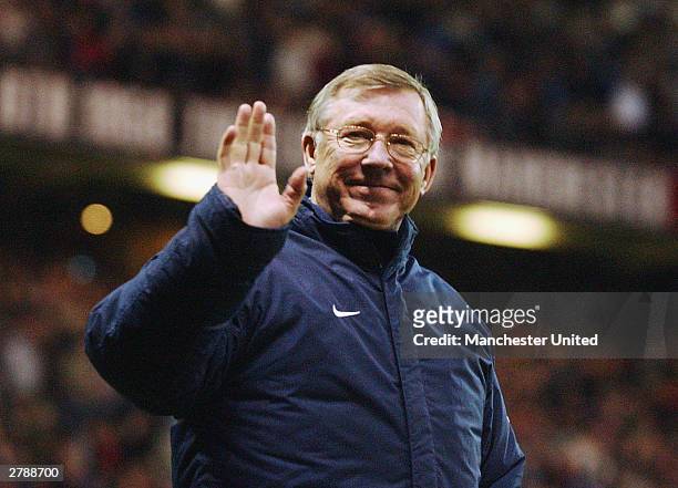Sir Alex Ferguson waves to the crowd at the start of the second half of the FA Premiership match between Manchester United and Aston Villa at Old...