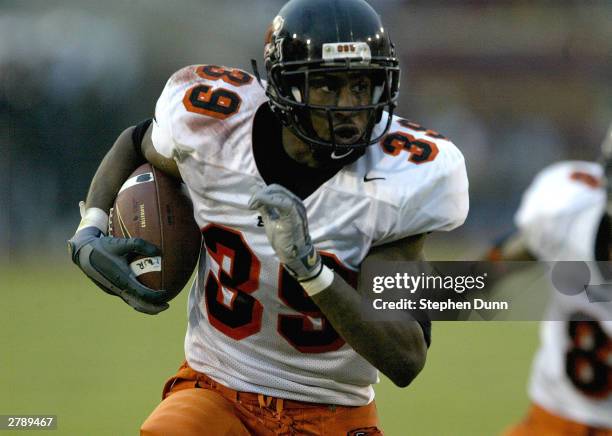 Defensive back Brandon Browner of the Oregon State Beavers returns an interception for a touchdown against the USC Trojans on December 6, 2003 at the...