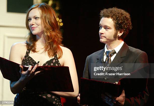 Actors Laura Prepon and Danny Masterson performon stage at the Church of Scientology's 11th Annual Christmas Stories Fundraiser to benefit the...