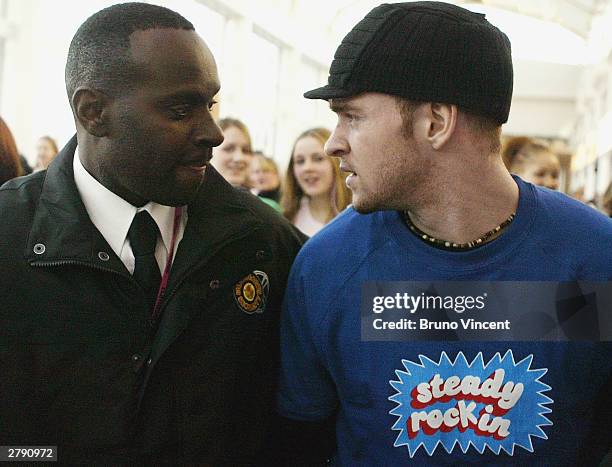 Dominic Curtin a Justin Timberlake look-a-like is escorted through screaming fans at the Clotheshow Live 2003, the world's largest consumer fashion...