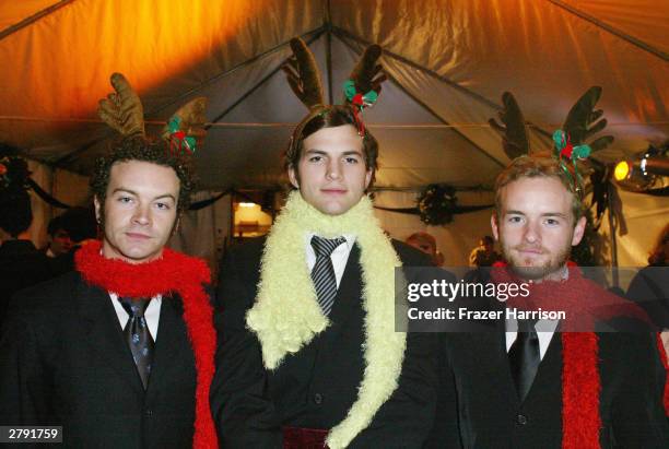 Actors Danny Masterson, Ashton Kutcher and Chris Masterson pose backstage at the Church of Scientology's 11th Annual Christmas Stories Fundraiser to...