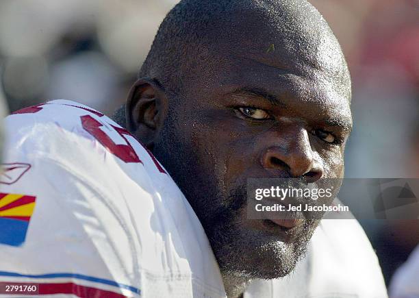 Leonard Davis of the Arizona Cardinals sits on the bench against the San Francisco 49ers during an NFL game on December 7, 2003 at Candelstick Park...