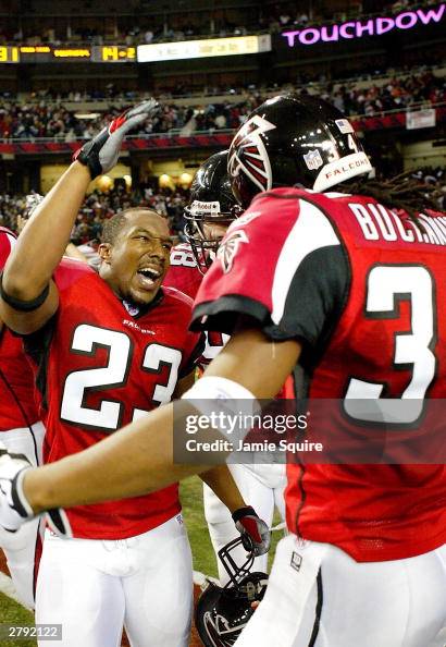 Kevin Mathis of the Atlanta Falcons is congratulated by Ray Buchanan ...