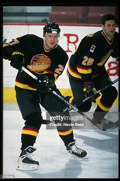 Vancouver Canucks rightwinger Mike Sillinger and defenseman Leif Rohlin look on during a game against the Colorado Avalanche at McNichols Sports...