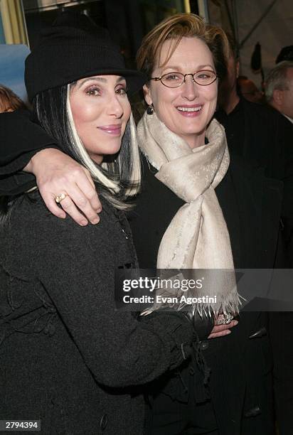 Singer/actress Cher and actress Meryl Streep arrive at the 20th Century Fox film premiere of "Stuck On You" December 8, 2003 in New York City.