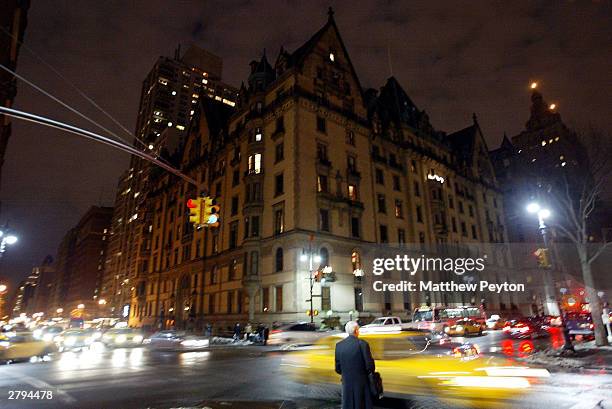 Traffic passes the Dakota apartment building on the 23rd anniversary of musician John Lennon's death December 8, 2003 in New York City.