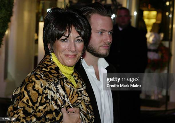 Socialite Ghislane Maxwell with an unidentified male companion attends the Opening of the Asprey Flagship Store on 5th Avenue December 8, 2003 in New...