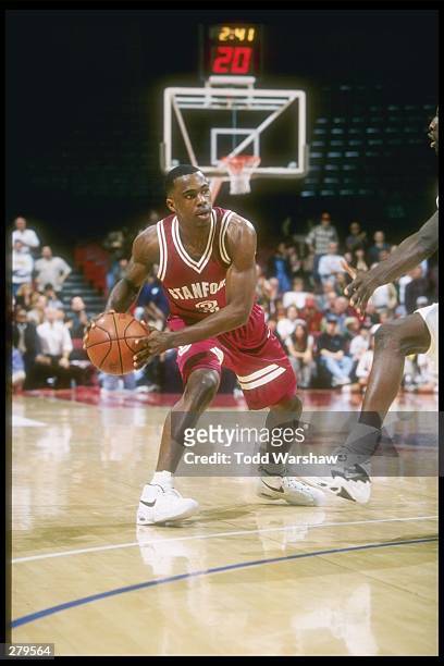 Guard Kris Weems of the Stanford Cardinal looks to pass the ball during a game against the USC Trojans at the Los Angeles Sports Arena in Los...