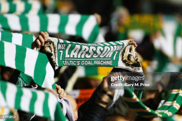 Celtic fans waving scarfs during the UEFA Champions League Group stage match between Glasgow Celtic and Bayern Munich on November 25, 2003 at the...