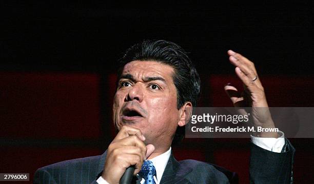 Actor/comedian George Lopez gestures as he performs during the Los Angeles Free Clinic's 27th Annual Benefit at the Reagent Beverly Wilshire Hotel...
