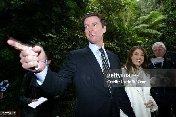 San Francisco mayoral candidate Gavin Newsom and his wife Kimberly Guilfoyle-Newsom leave a polling place after they cast their ballots for the...