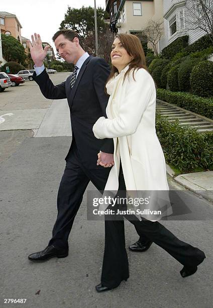 San Francisco mayoral candidate Gavin Newsom and his wife Kimberly Guilfoyle-Newsom walk home after they cast their ballots for the mayoral run-off...