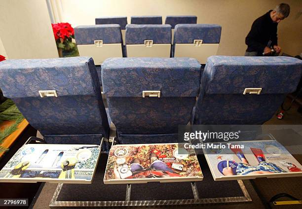 New tray table advertising by SkyMedia to be installed on America West Airlines planes are seen December 9, 2003 in New York City. Mercedes-Benz,...