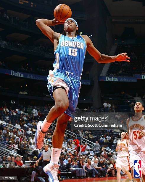 Carmelo Anthony of the Denver Nuggets shoots against the Atlanta Hawks during a game December 9, 2003 at Philips Arena in Atlanta, Georgia. NOTE TO...