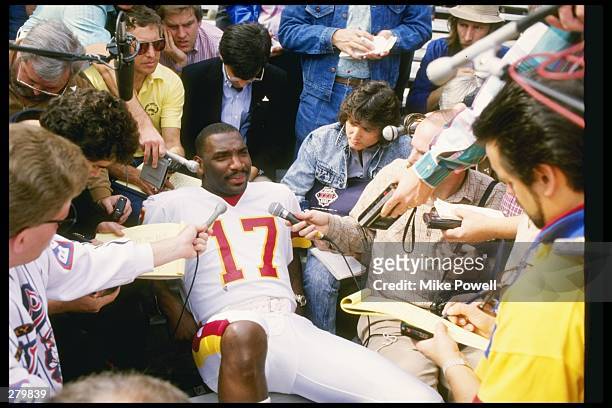 Quarterback Doug Williams of the Washington Redskins fields questions during Media Day for Super Bowl XXII against the Denver Broncos at Jack Murphy...