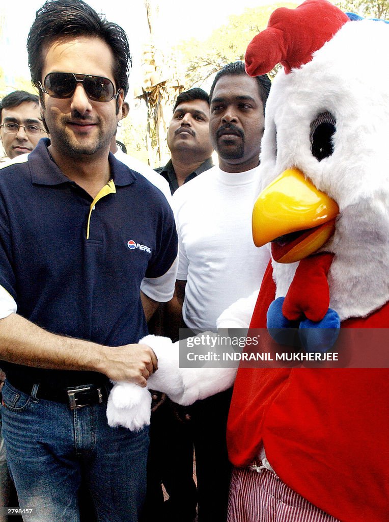 Indian film actor Fardeen Khan (L) poses