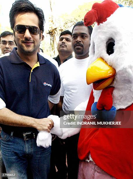 Indian film actor Fardeen Khan (L) poses, News Photo