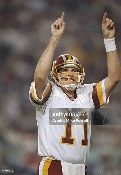 Quarterback Mark Rypien of the Washington Redskins celebrates during Super Bowl XXVI against the Buffalo Bills at the Hubert H. Humphrey Metrodome in...