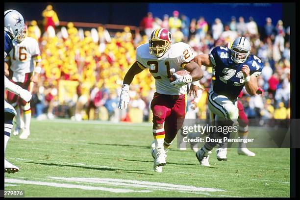 Running back Earnest Byner of the Washington Redskins moves the ball during a game against the Dallas Cowboys at RFK Stadium in Washington, D. C. The...