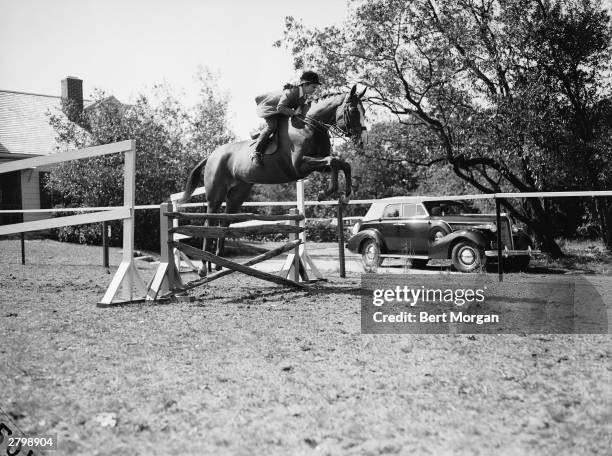 Jacqueline Bouvier jumps her horse Danseuse at the Piping Rock Horse Show, Locust Valley, New York, October 1, 1938.