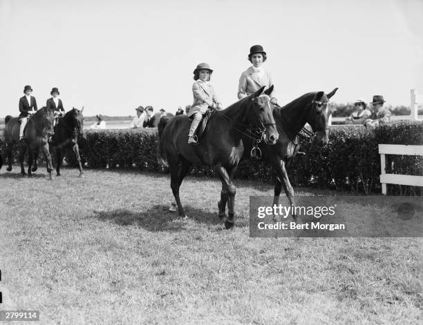 Jacqueline Bouvier and her mother, Janet Lee Bouvier, ride horses at the East Hampton Horse Show, Long Island, New York, August 14, 1937. Jeanne...
