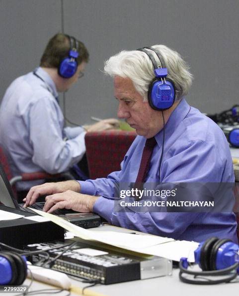 Washington Post reporter Ken Ringle listens to the newly released 240 ...