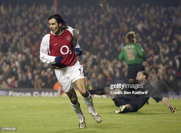 Robert Pires of Arsenal celebrates scoring the first goal for Arsenal during the UEFA Champions League Group B match between Arsenal and Lokomotiv...