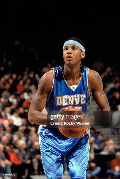 Carmelo Anthony of the Denver Nuggets takes the free throw against the Golden State Warriors during the NBA game at The Arena in Oakland on December...