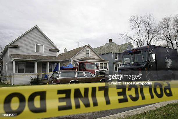 Home on Ash Avenue where police found at least two bodies buried in the basement is shown December 10, 2003 in Hammond, Indiana. Police searched the...