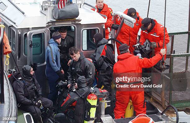 New York State Police divers return from the recovery and rescue for the capsized ship Stellamare December 10, 2003 in Albany, New York. The 289-foot...