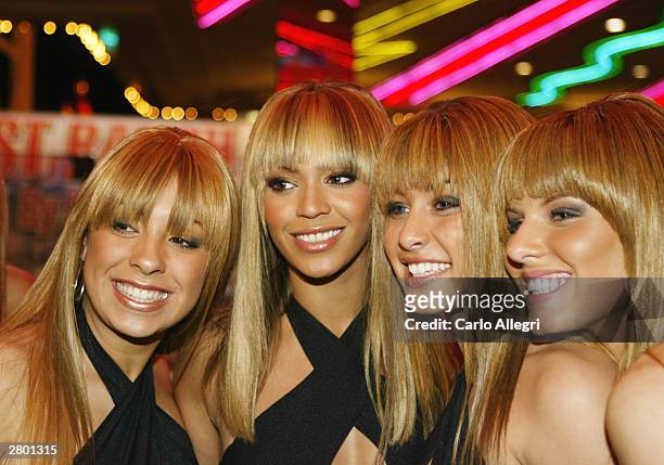 Singer Beyonce Knowles poses for photos with look alikes at the MGM Grand Hotel on December 10, 2003 in Las Vegas, Nevada.