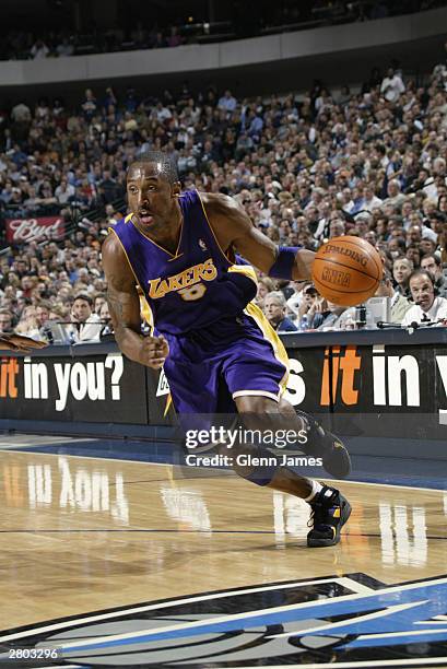 Kobe Bryant of the Los Angeles Lakers drives to the hoop during the game against the Dallas Mavericks at the American Airlines Center on December 4,...