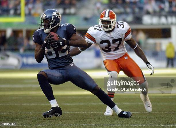 Darrell Jackson of the Seattle Seahawks carries the ball during the game against the Cleveland Browns on November 30 2003 at Seahawks Stadium in...